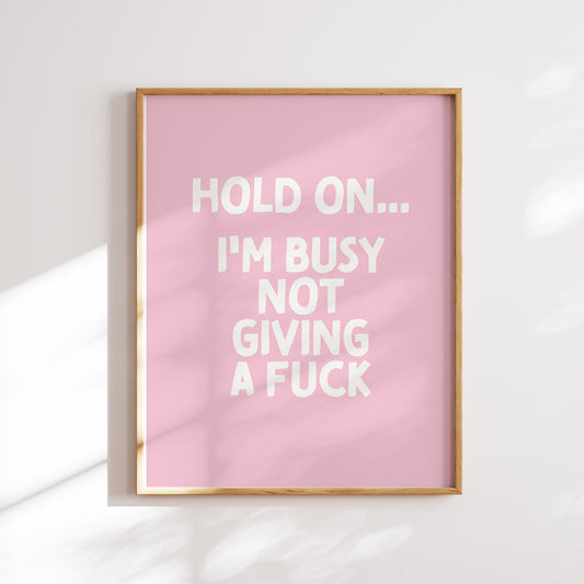 Trendy printable wall art poster featuring a  "I'm busy not giving a fuck" text in a stylish cream and baby pink design. Perfect for adding a touch of cool humor to any room or as a unique gift. Instantly downloadable and easy to print at home or through a professional service.
Shop unique wall art by WonkyWonder now.