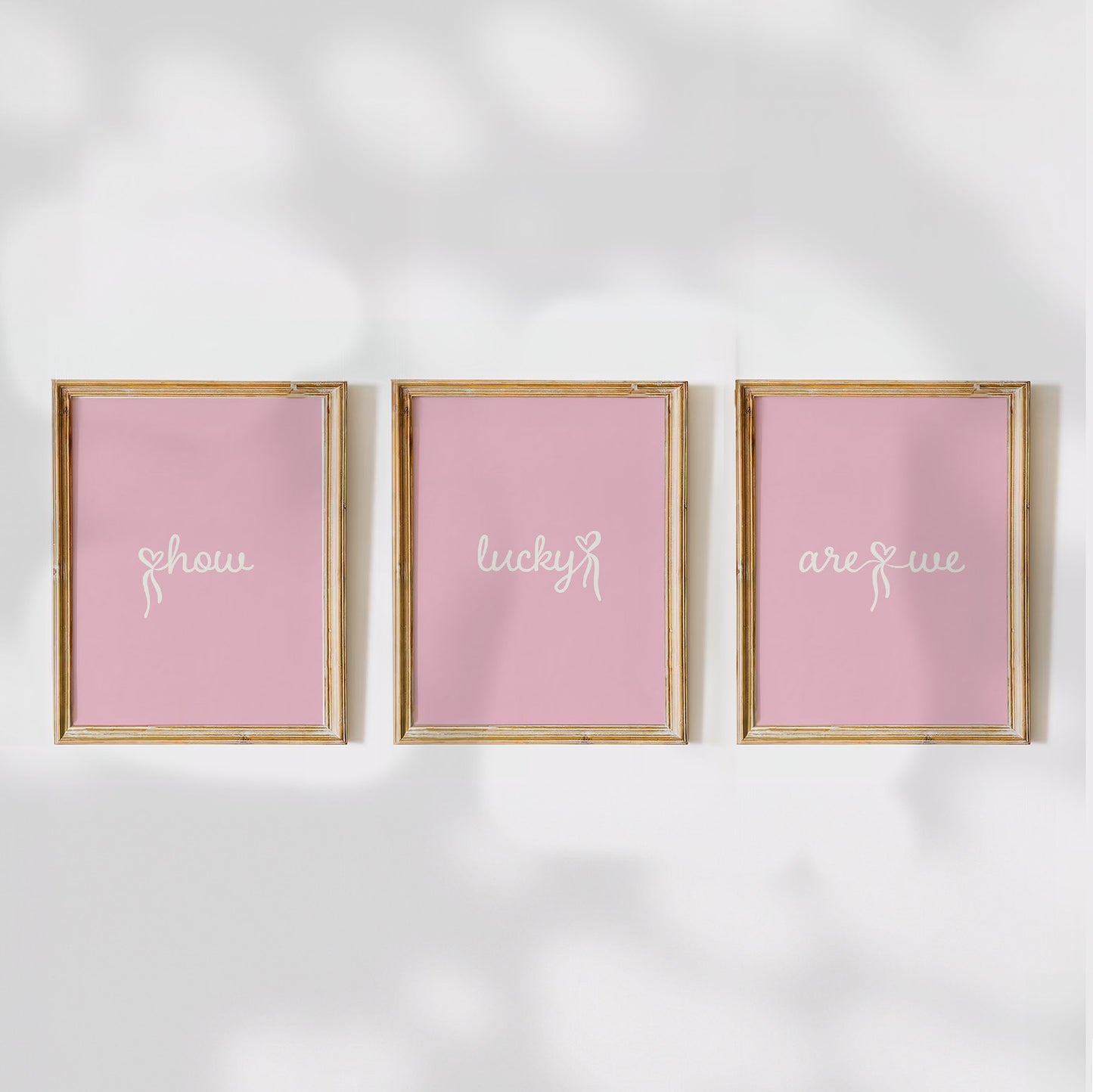 Set of 3 aesthetic pink posters with cursive text reading “How Lucky Are We” in white. Digital download wall art for a stylish gallery setup. 