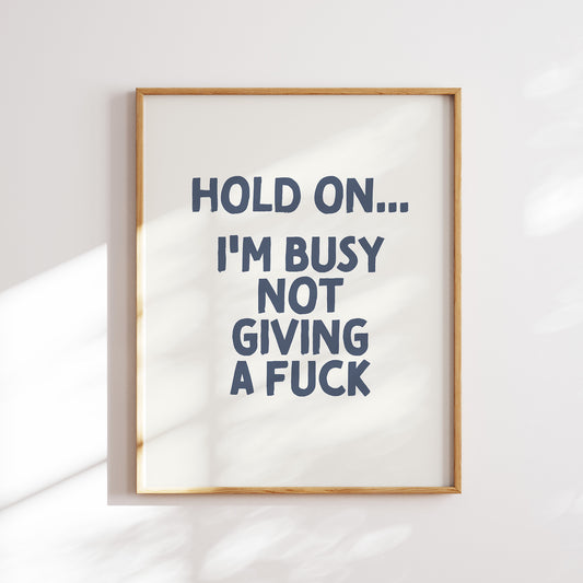 Hold on I'm busy not giving a fuck trendy funny  home office wall art slogan in cream and navy blue