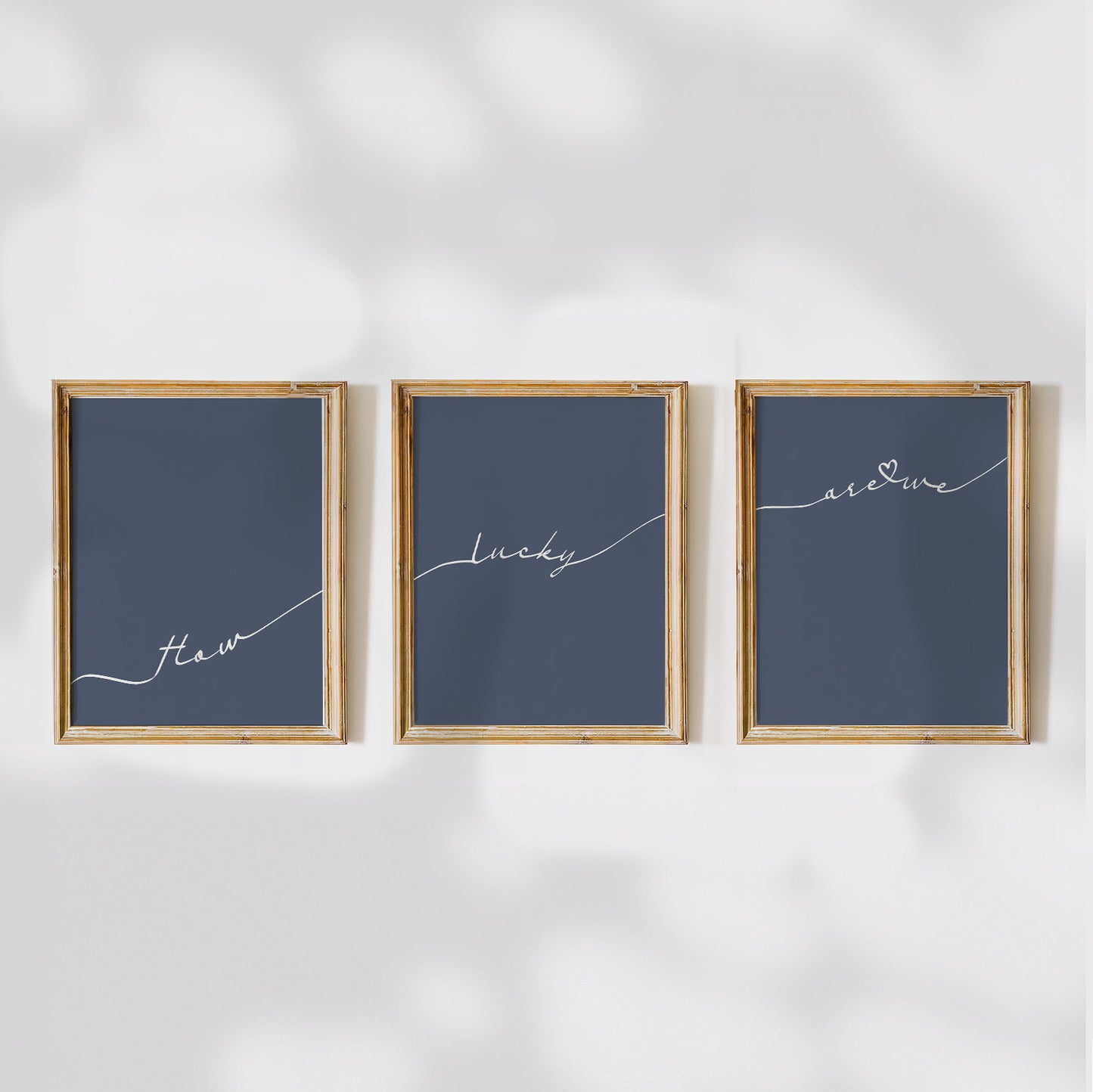 Set of 3 preppy aesthetic navy blue posters with cursive text “How Lucky Are We” in white. Perfect for motivational gallery walls or above-the-bed decor.  