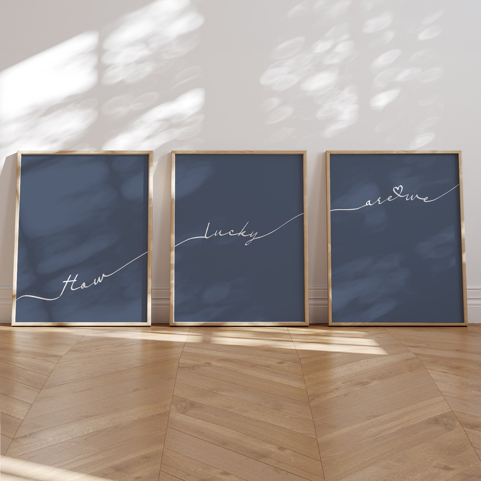 Set of 3 preppy aesthetic navy blue posters with cursive text “How Lucky Are We” in white. Perfect for motivational gallery walls or above-the-bed decor.  