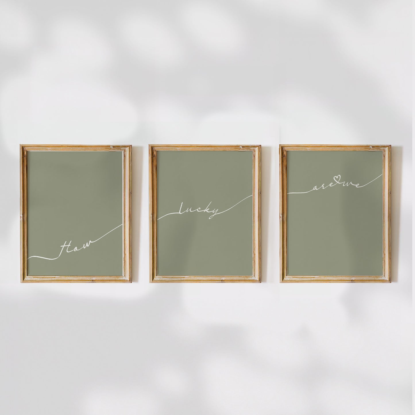 Set of 3 preppy aesthetic sage green posters with cursive text “How Lucky Are We” in white. Perfect for motivational gallery walls or above-the-bed decor.  