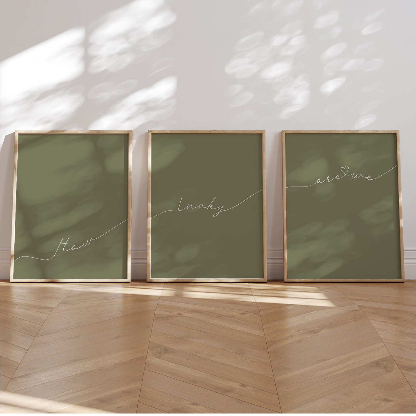 Set of 3 preppy aesthetic sage green posters with cursive text “How Lucky Are We” in white. Perfect for motivational gallery walls or above-the-bed decor.  